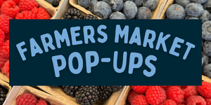 Vibrant photo of blueberries, raspberries, and blackberries set against the words "Farmers Market Pop-Ups"