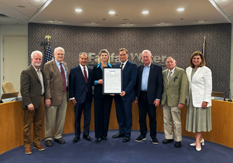 A photo of the Fairfax Water Board members presenting a framed proclamation to retiring Fairfax Water General Manager Jamie Hedges